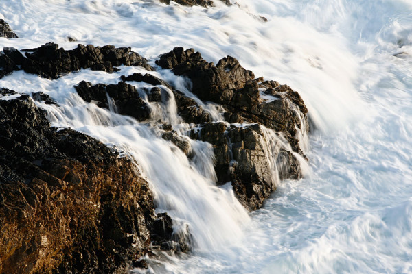 Photo of pacific surge on granite rocks — Big Sur, California